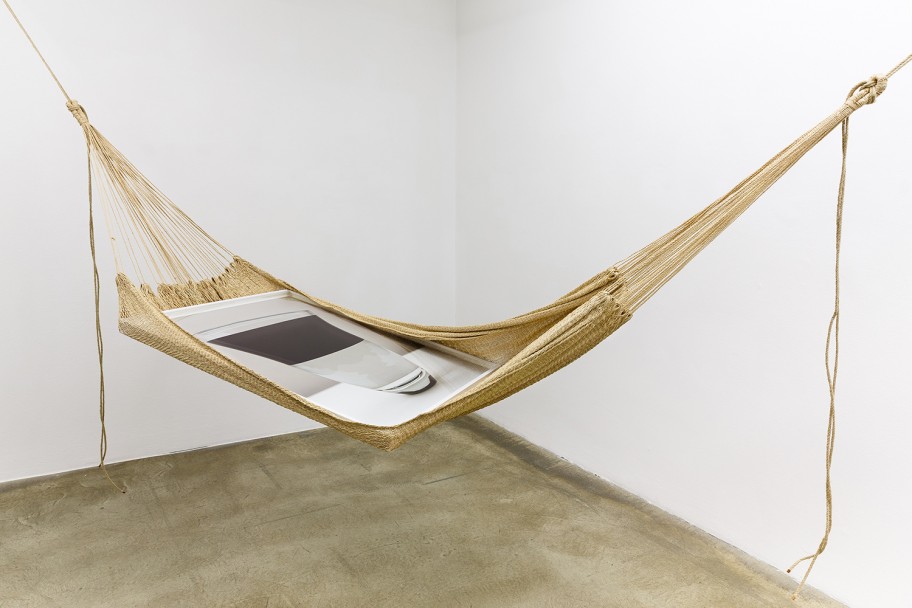 Alessandro Balteo-Yazbeck in collaboration with unknown Warao artisan and Holger Niehaus   Warao Chinchorro / Hammock, (water-oil). 2004-2014. From the series Modern Entanglementsinstallation, hand-woven Moriche Palm fiber hammock, framed archival pigment print by Holger Niehaus dimensions variable 