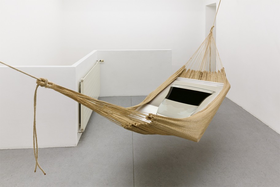 Alessandro Balteo-Yazbeck in collaboration with unknown Warao artisan and Holger Niehaus   Warao Chinchorro / Hammock, (water-oil), From the series Modern Entanglements-Sovereignty, 2004–2014 installation of Hand-woven Moriche Palm fiber hammock, framed archival pigment print by Holger Niehaus (Untitled, 2010) ca. 300 x 400 x 300 cm 