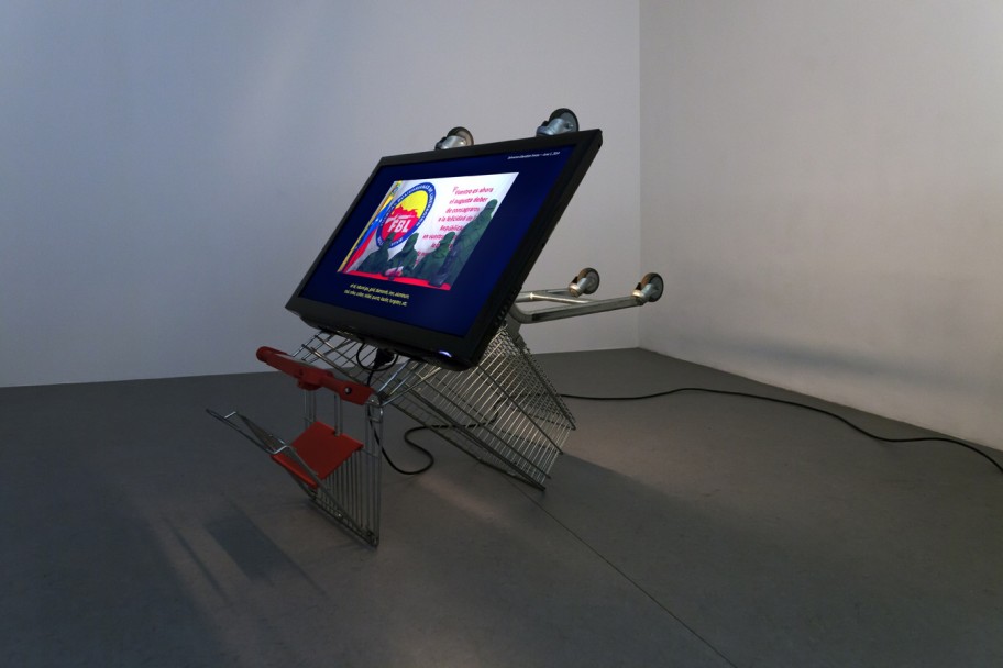 Alessandro Balteo-Yazbeck in collaboration with Ana Alenso  Homeland’s Agenda, (detail) 2016. From the series Electoral AutocracyHDTV Monitor, lamp and digital player installed on supermarket cart; custom made seats; single channel HD video, stereo sound, Spanish with English subtitles 29 min, 122 x 148 x 102 cm 